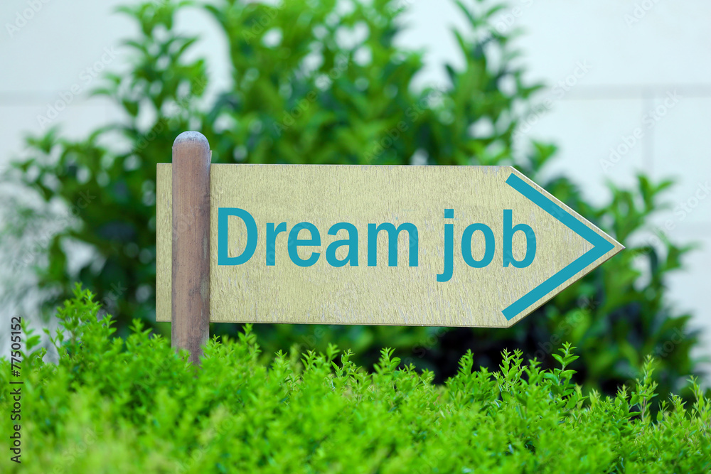 Pointer with Dream Job text on it on green bush background