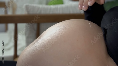 Spreading the cream around the skin to protect it
