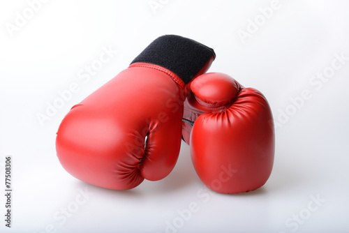 Pair of red leather boxing gloves isolated on white © num_skyman