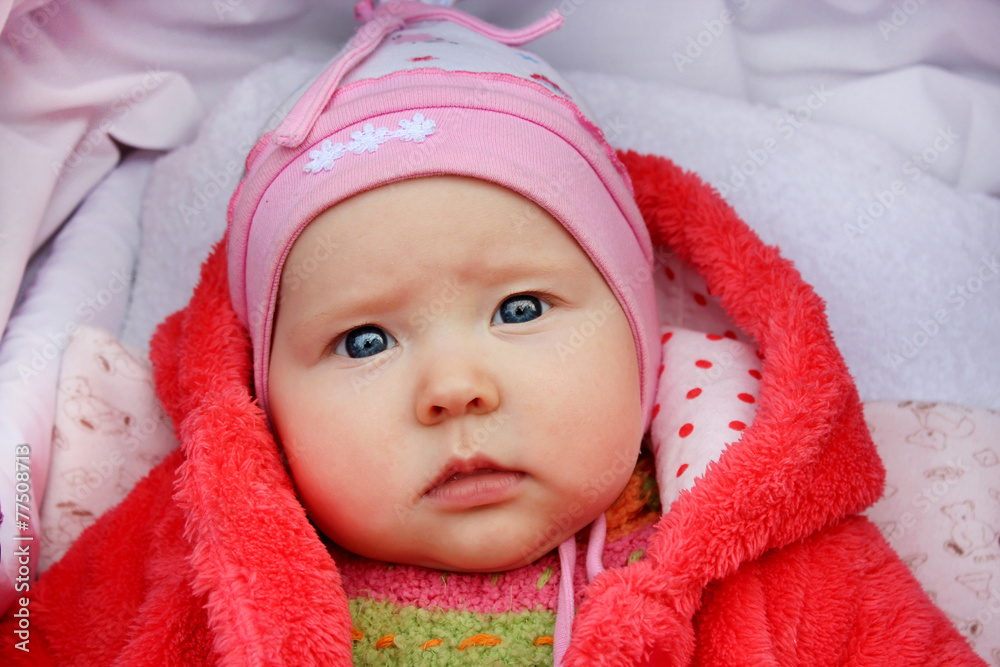 little baby with sad sight in the perambulator little baby with sad sight in the perambulator