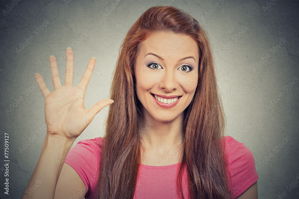 woman showing five times sign hand gesture on grey background woman showing five times sign hand gesture on grey background