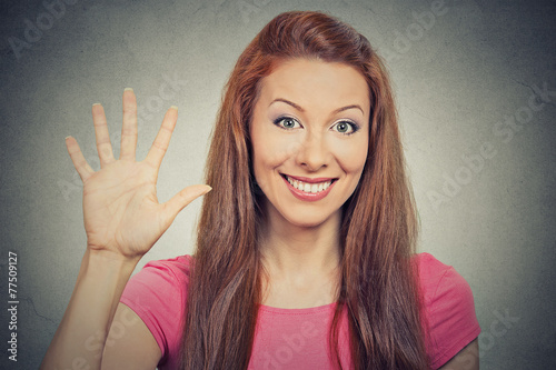 woman showing five times sign hand gesture on grey background 