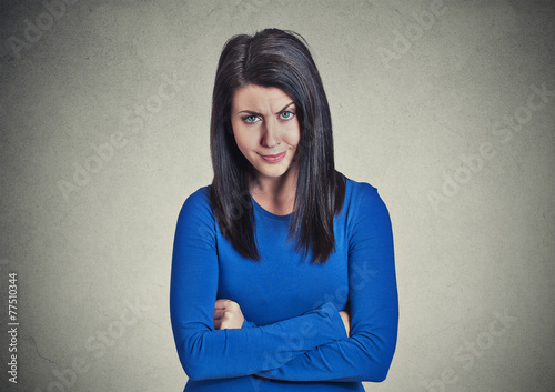 portrait skeptic doubtful woman looking at you camera