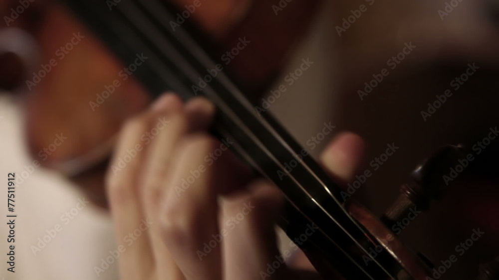 Close up pan shot of a violin player Close up pan shot of a violin player