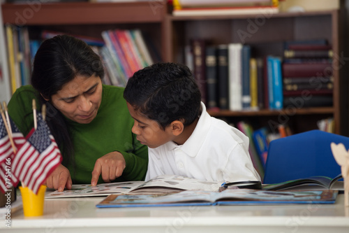 HIspanic Mom and Boy in Home-school Setting Studying Rocks