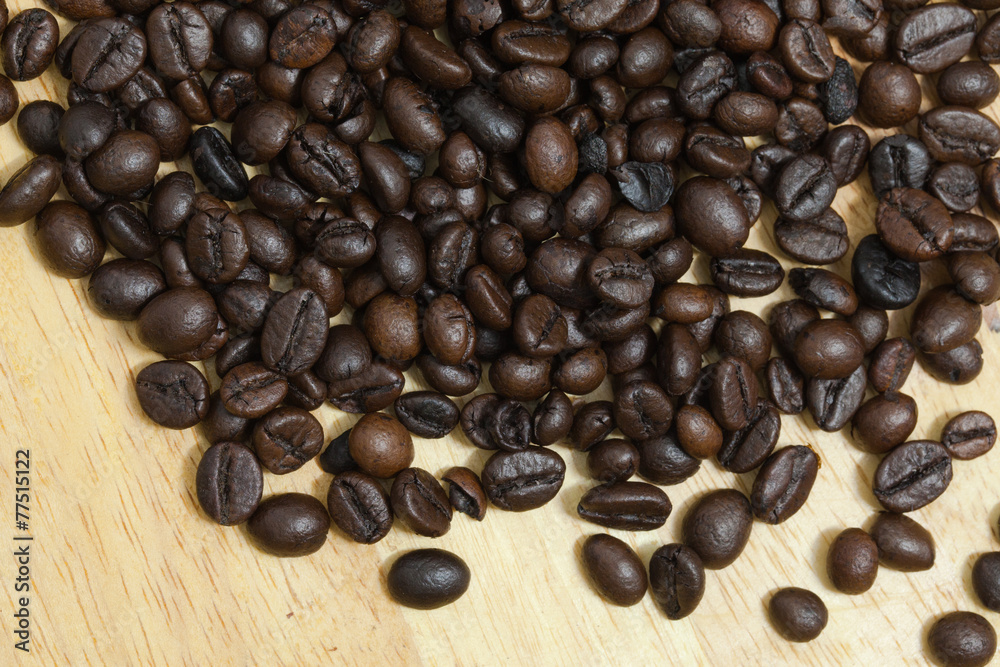 Fototapeta premium Coffee bean on wooden background.