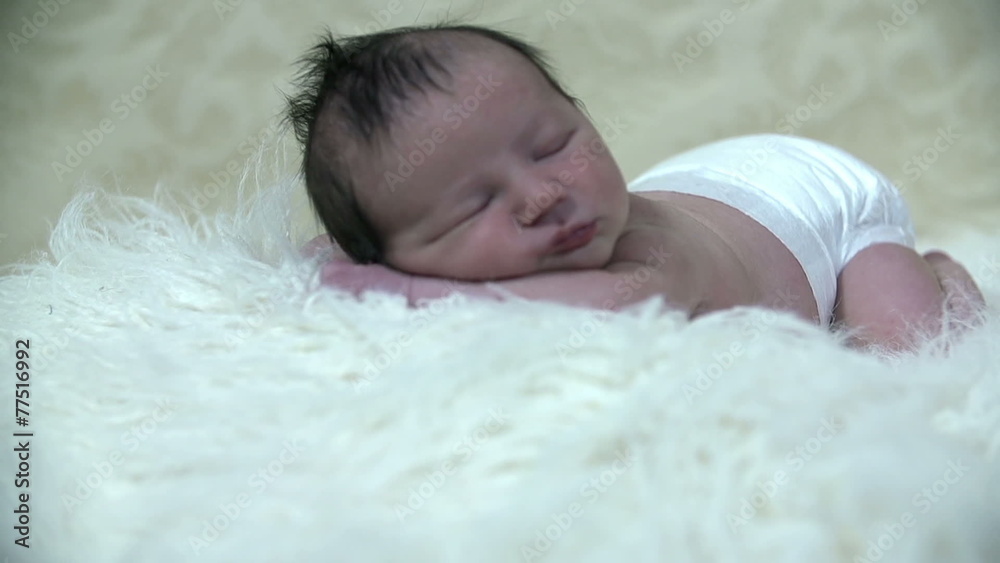 Baby boy laying on white furry blanket Baby boy laying on white furry blanket