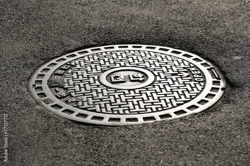 steel sewer cover on the street in Seoul, South Korea