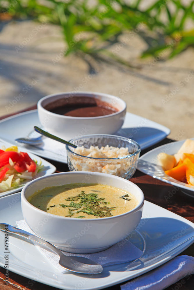 cream soup served with fresh vegetables and fruits cream soup served with fresh vegetables and fruits