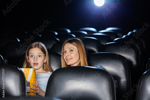 Amazed Mother And Daughter Watching Movie