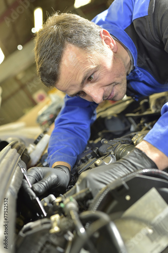 Technician working in auto repair shop