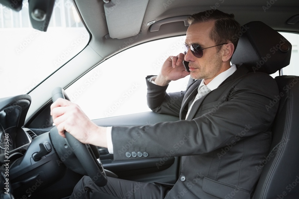Businessman on the phone wearing sunglasses