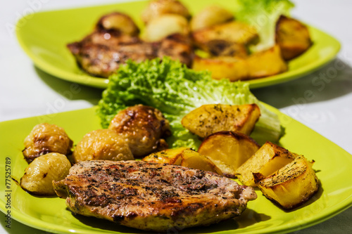 Chicken steak with roasted onions and potatoes