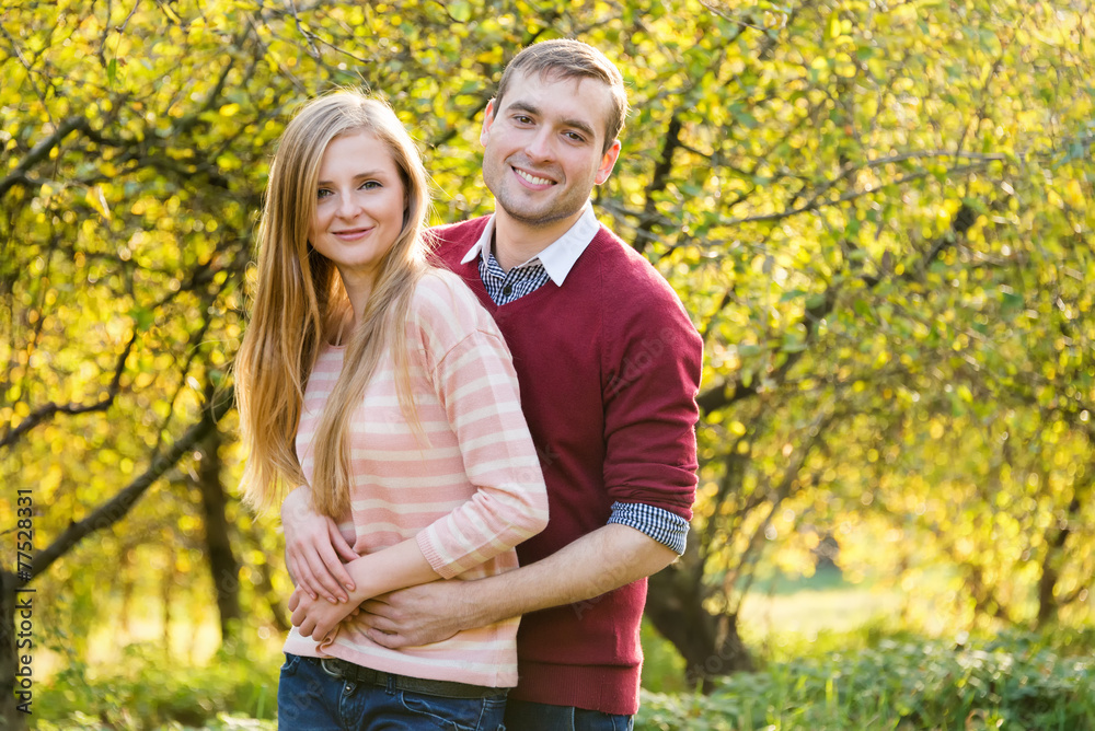 Young couple in love outdoor. Happy people in love walking in Young couple in love outdoor. Happy people in love walking in