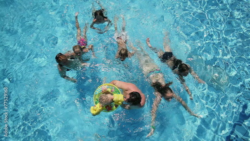 Wallpaper Mural Low to high angle shot of family enjoying water park in summer Torontodigital.ca