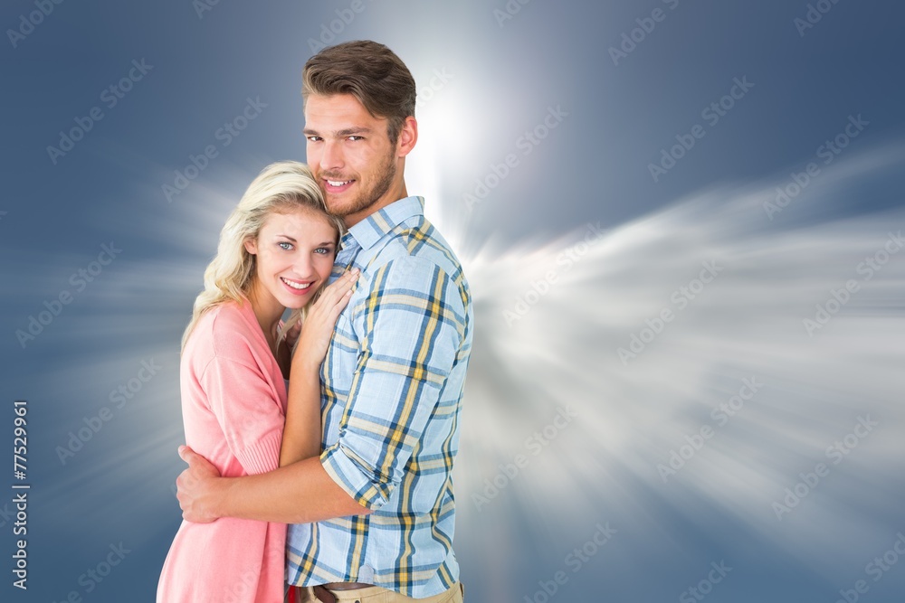 Attractive couple embracing and smiling at camera Attractive couple embracing and smiling at camera