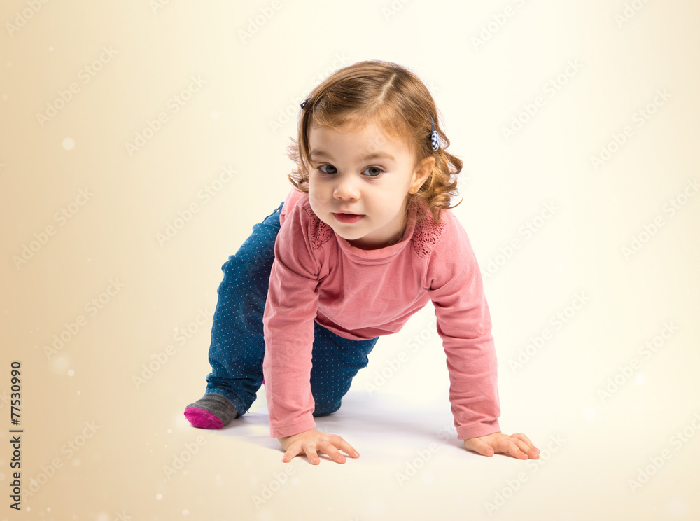 Little girl crawling over white background Little girl crawling over white background