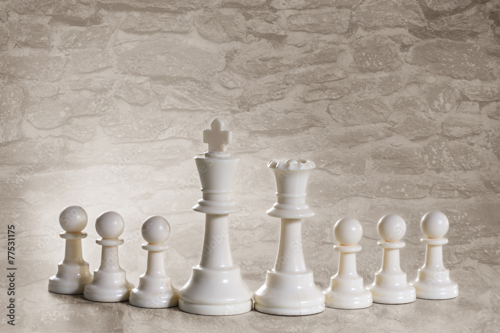 White chess pieces in a row White chess pieces in a row