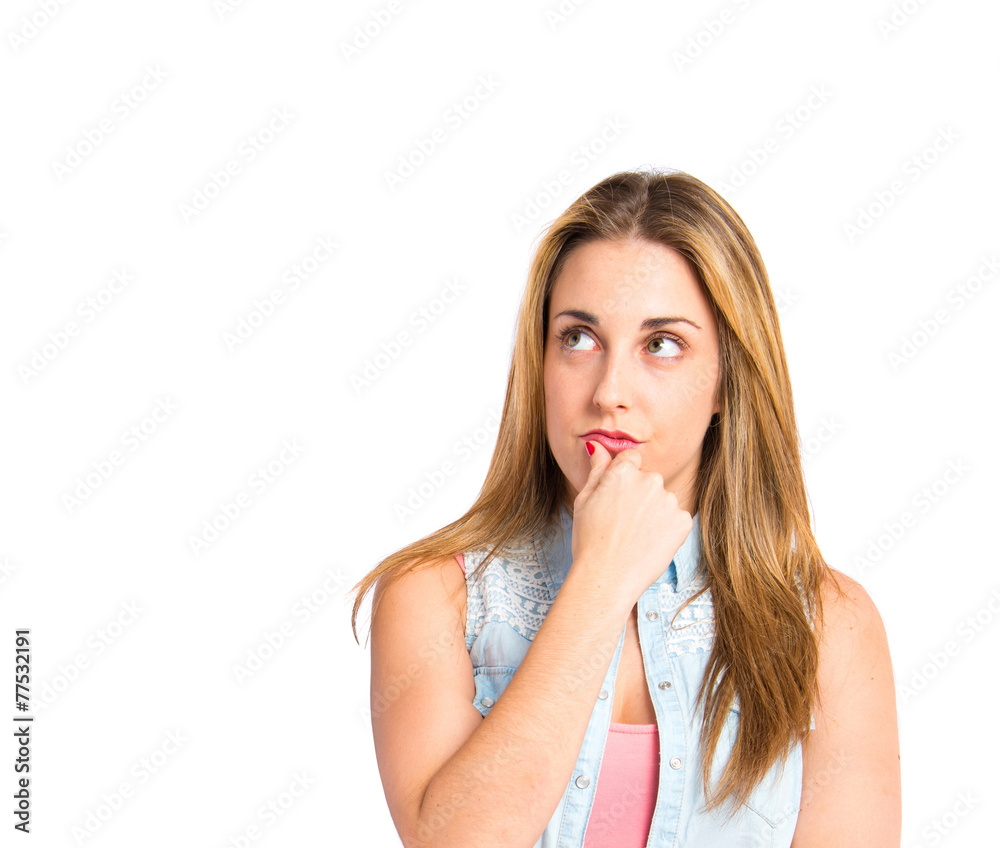 Girl thinking over isolated white background Girl thinking over isolated white background