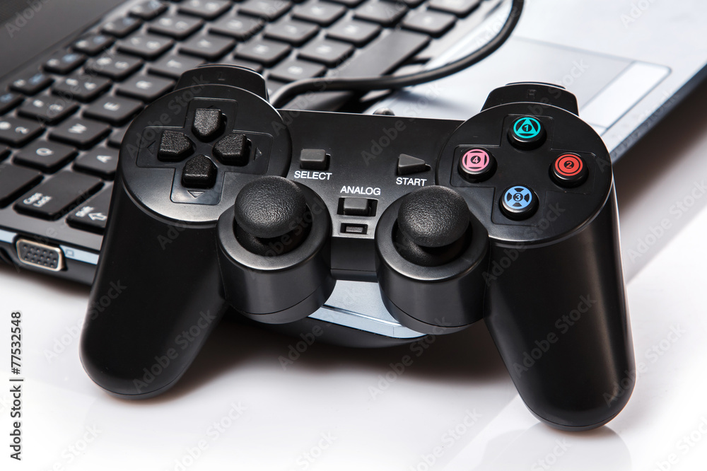 Gamepad is lying on a keyboard Gamepad is lying on a keyboard