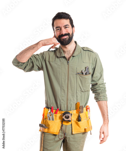 Mechanic making phone gesture