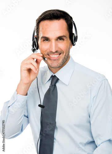 smiling man with headset working as a call center operator