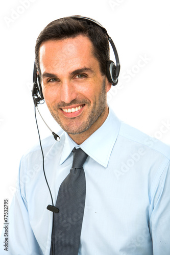 smiling man with headset working as a call center operator