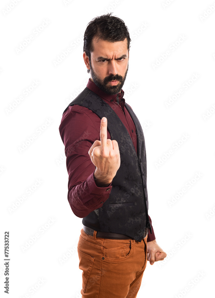 Fototapeta premium Man wearing waistcoat making horn gesture