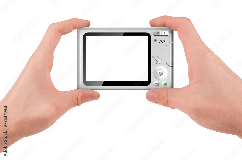 Hand holding a compact digital camera with empty LCD screen Hand holding a compact digital camera with empty LCD screen
