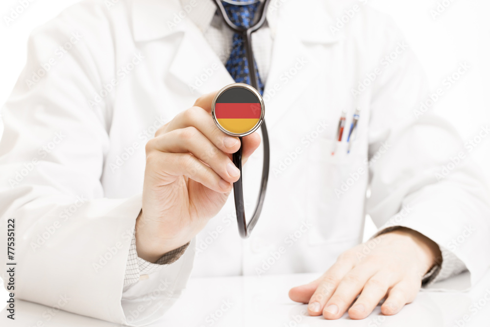 Doctor holding stethoscope with flag series - Germany