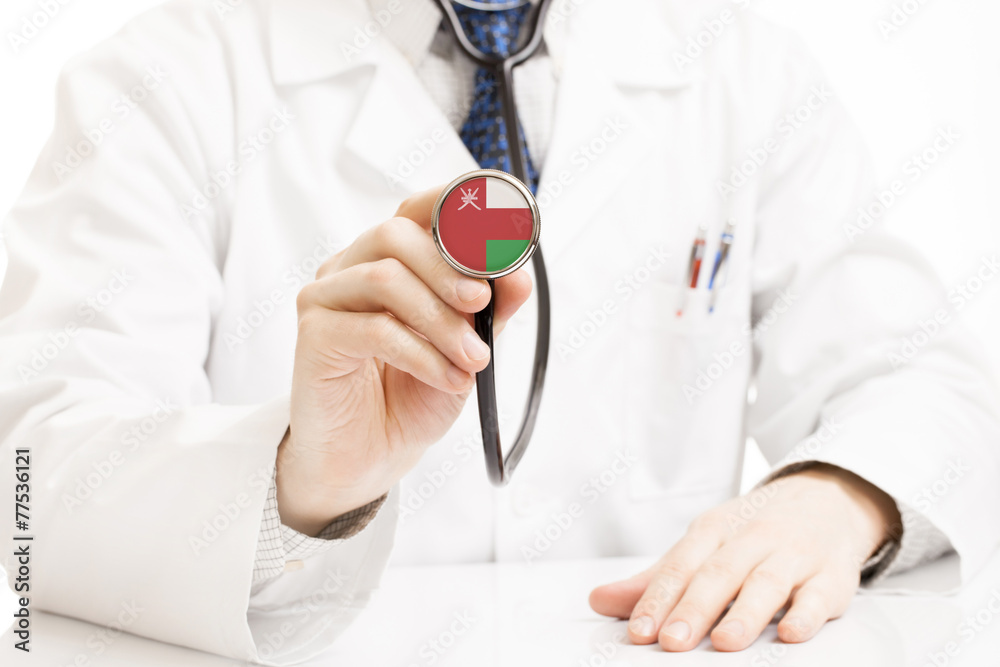 Doctor holding stethoscope with flag series - Oman Doctor holding stethoscope with flag series - Oman