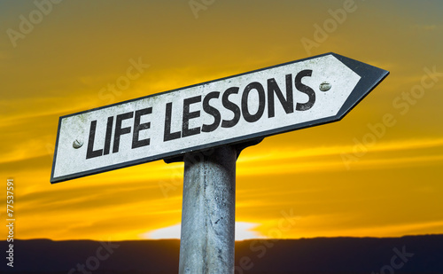 Life Lessons sign with a sunset background photo