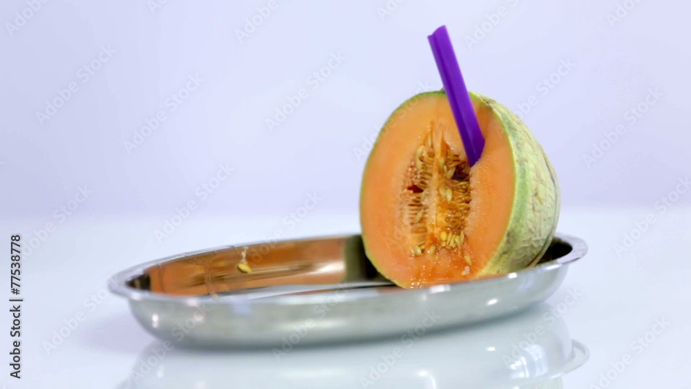 Arranging pieces of melon on silver plate with white background Arranging pieces of melon on silver plate with white background