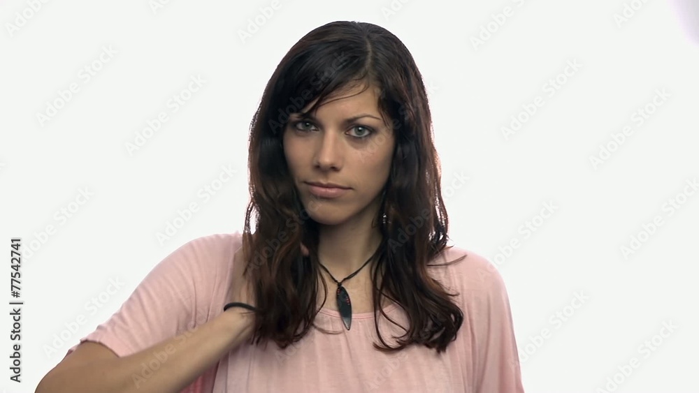 Girl posing in front of camera on white background
Girl posing in front of camera on white background