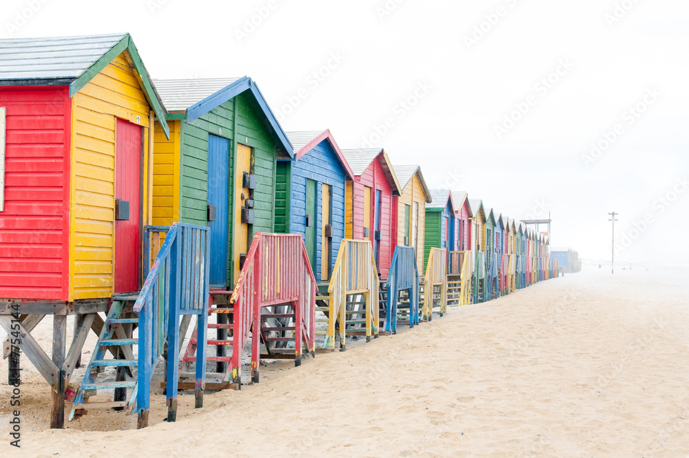 Naklejka premium Multi-colored beach huts at Muizenberg