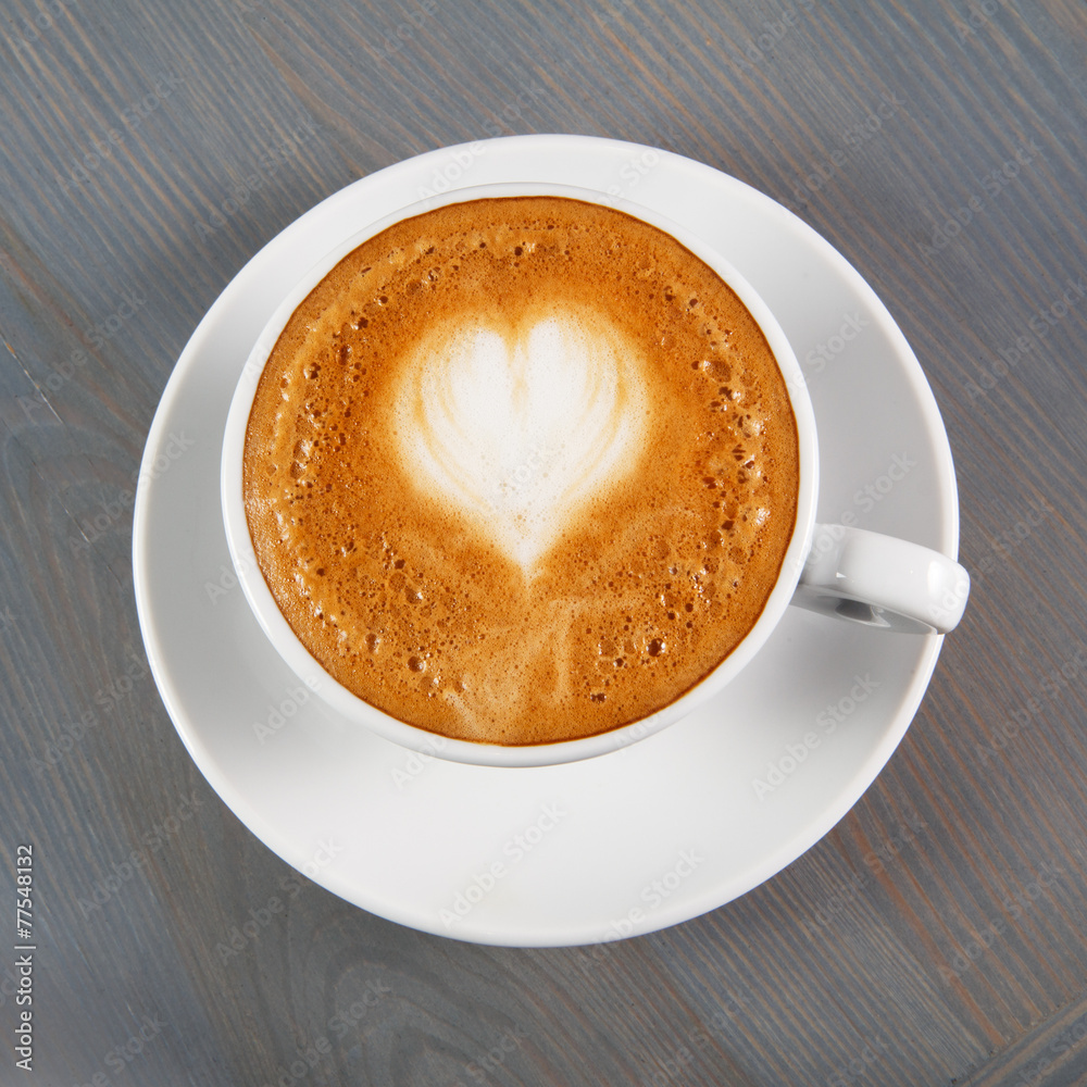 Cup of cappuccino coffee with heart Cup of cappuccino coffee with heart