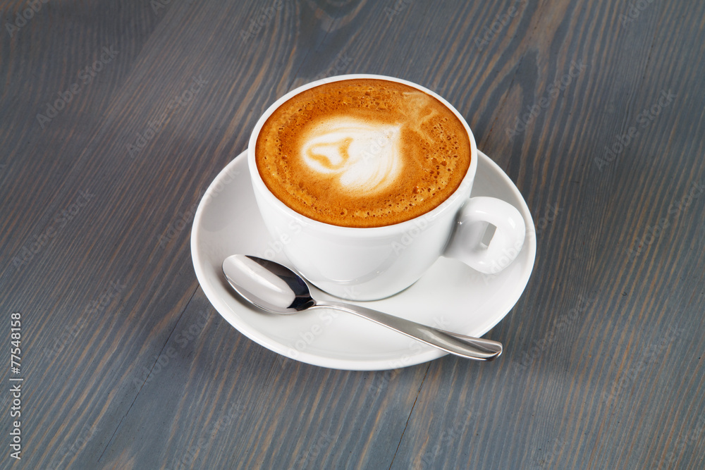Obraz premium Cup of cappuccino coffee with heart