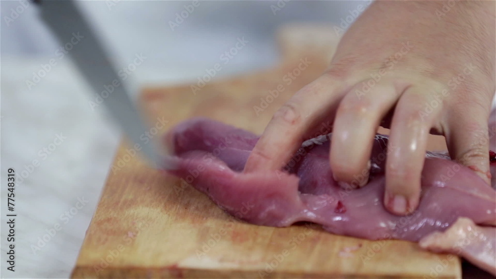 Slicing bigger cuts of turkey meat for steaks