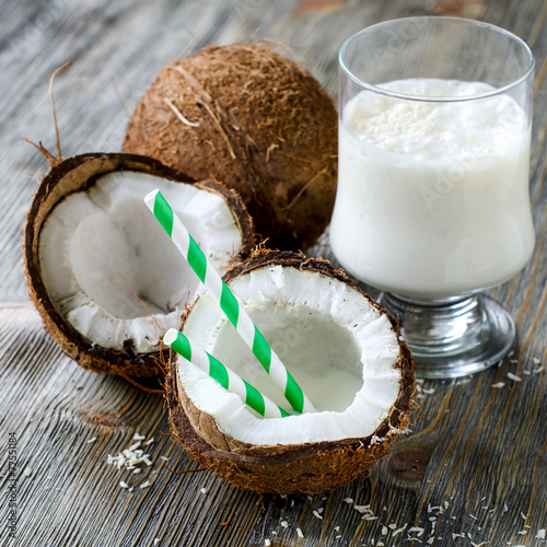 Coconut milk smoothie drink on wooden background