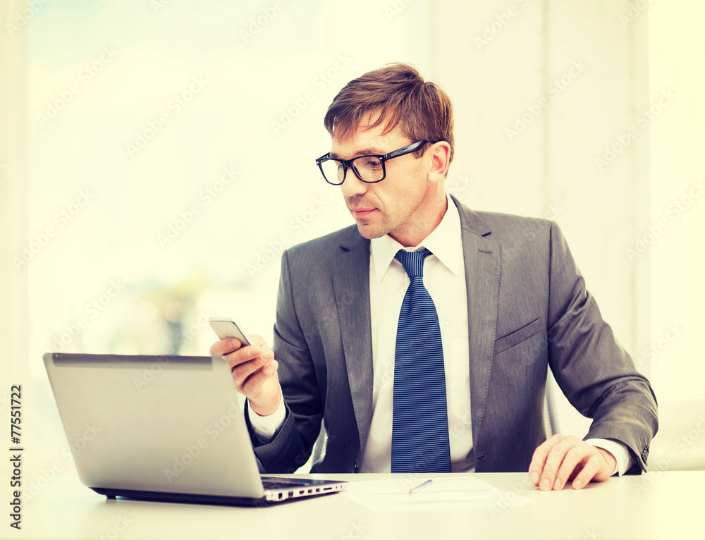 businessman working with laptop and smartphone