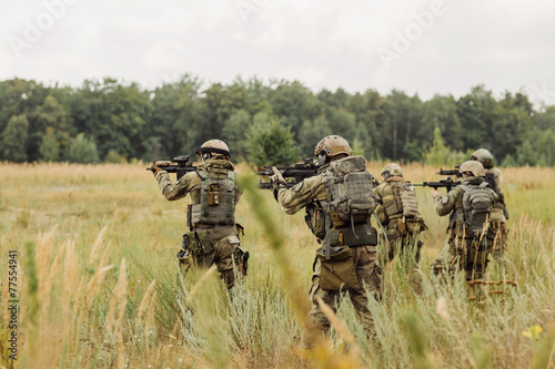 group of soldiers conducting an offensive against the enemy