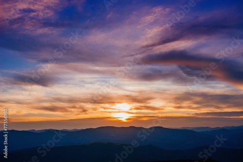 colorful sky with sun background in mountains. sunset, sunrise. © standret