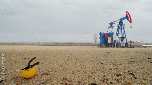 Pumpjack Oil Pump operating on natural gas in the oil field photo