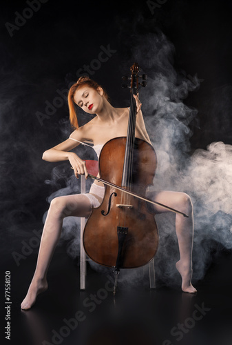 Naked girl playing cello © sergeymalov