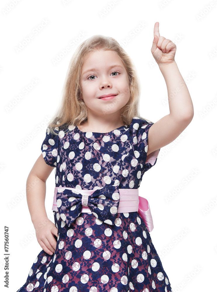 Beautiful little girl showing on something by finger isolated Beautiful little girl showing on something by finger isolated