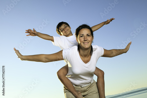 a mother having fun with his son photo