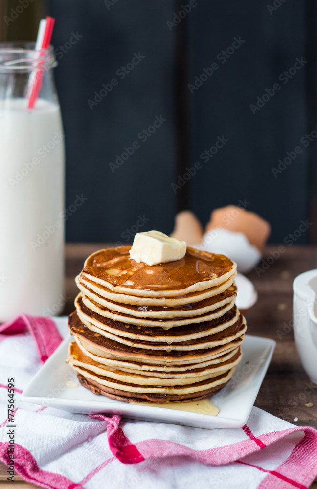 Pancake with butter, honey and milk, sweet breakfast Pancake with butter, honey and milk, sweet breakfast