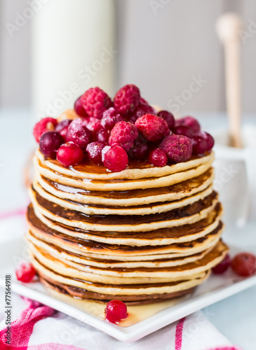 Pancake with cranberries, raspberries and honey, sweet
