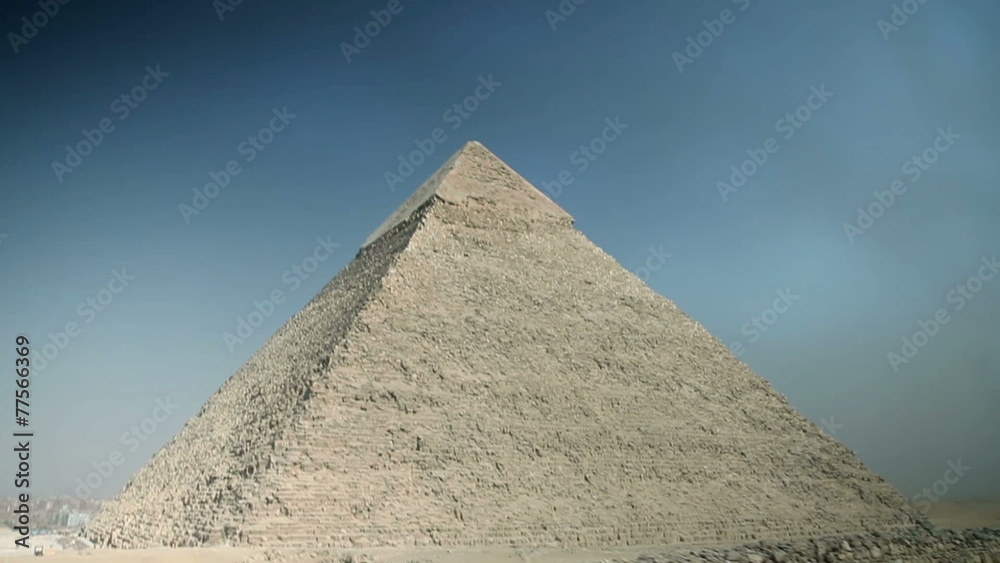 Driving with vehicle by the big pyramid with blue sky Driving with vehicle by the big pyramid with blue sky