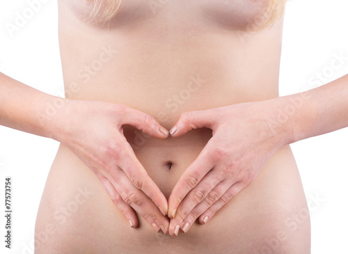 Young Woman with Heart Shaped Hands in front of Belly. © william87